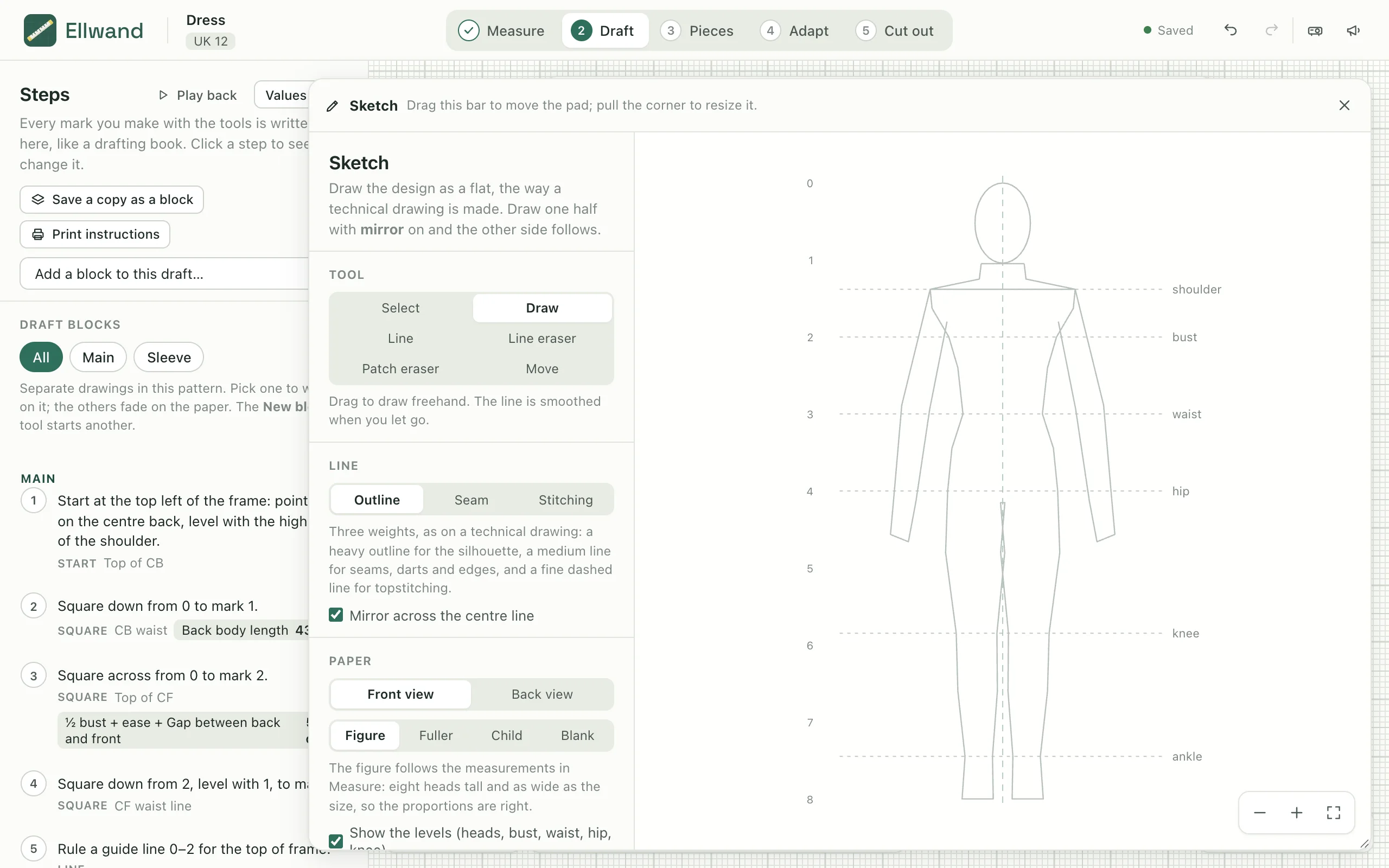 The sketch pad open over the draft, with a figure to draw over